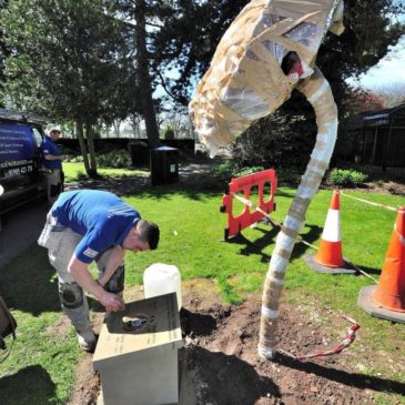 Poppy sculpture being installed in Cripplegate Park - designed by Living Mosaics